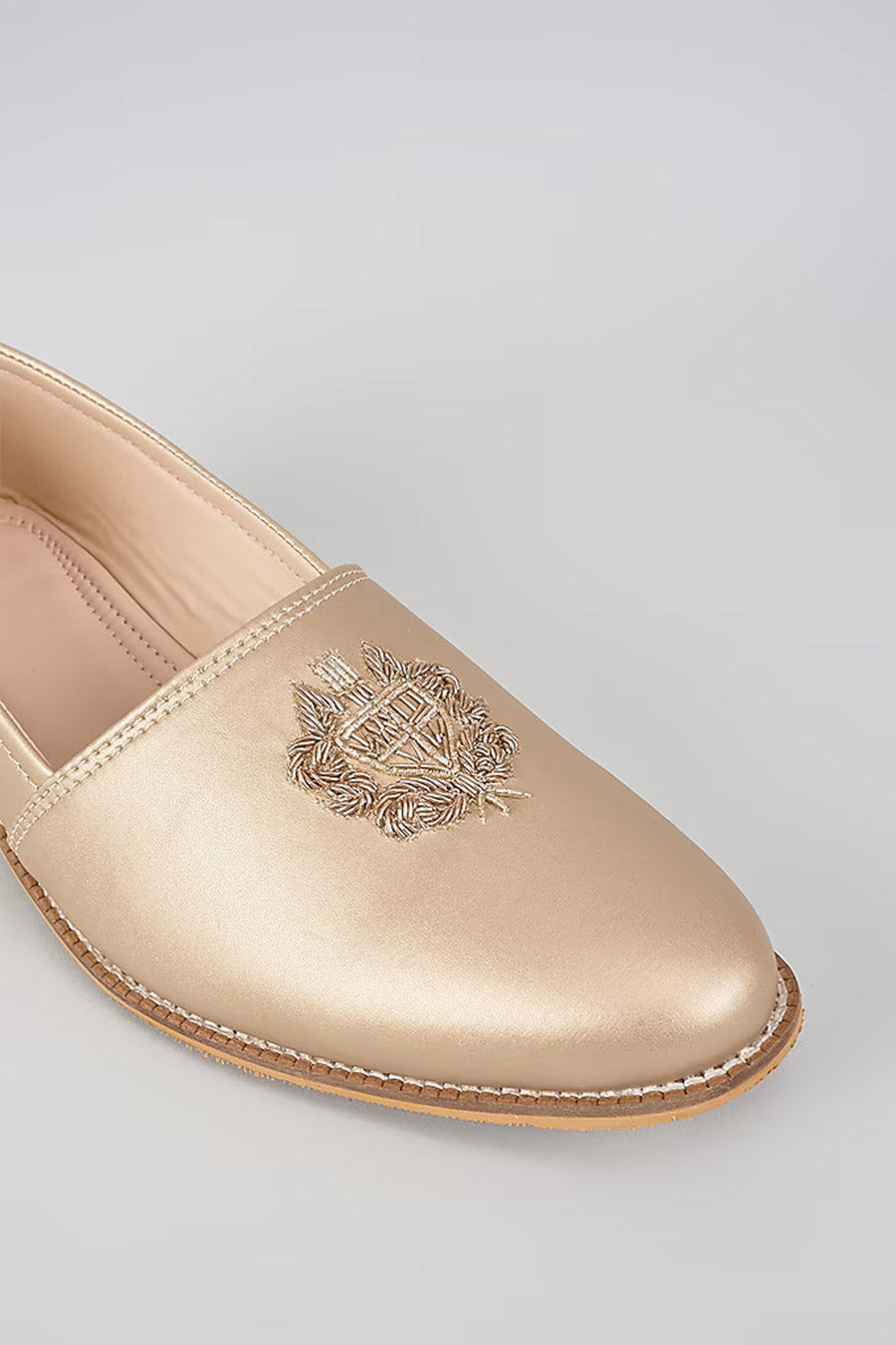 Muted Gold Zari Embroidered Royal Crest Juttis