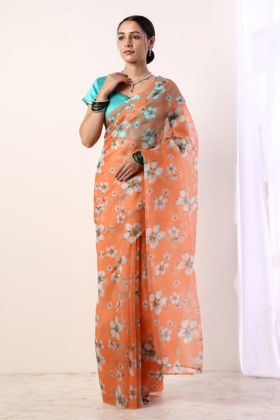 Coral Printed Organza Saree & Teal Blouse